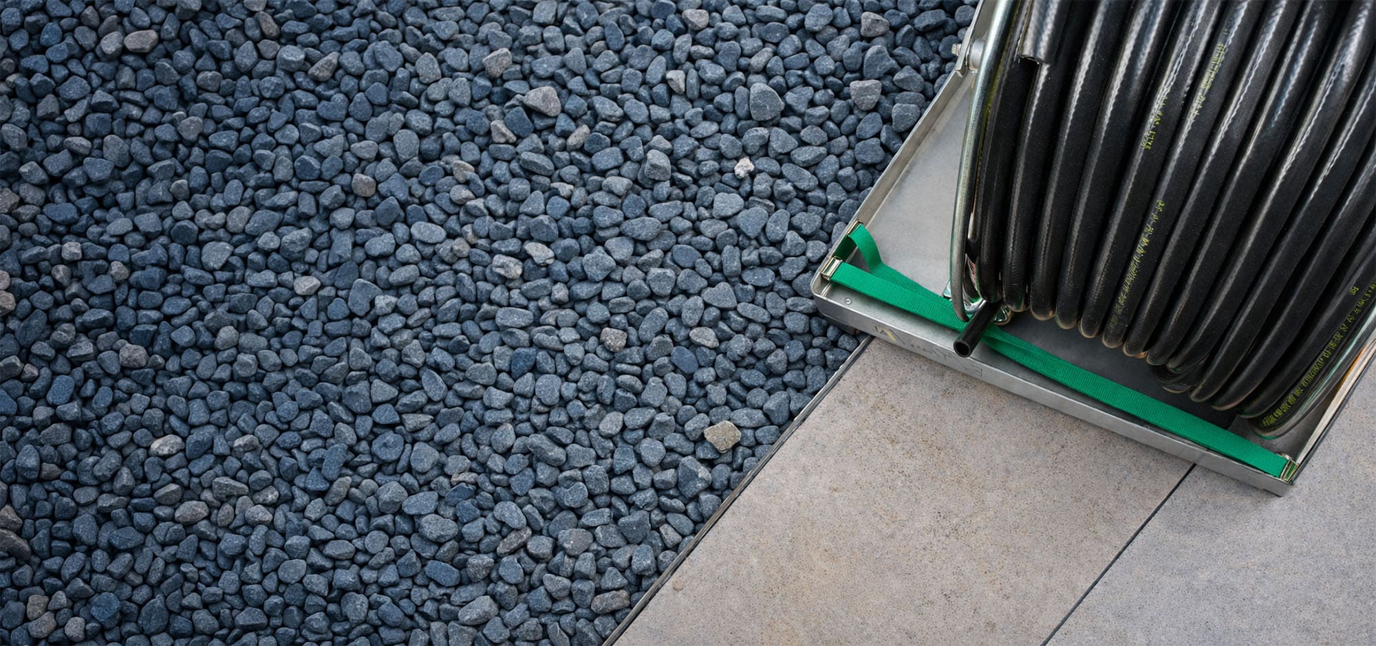 A Grove reticulation hose reel on a home’s paved perimeter